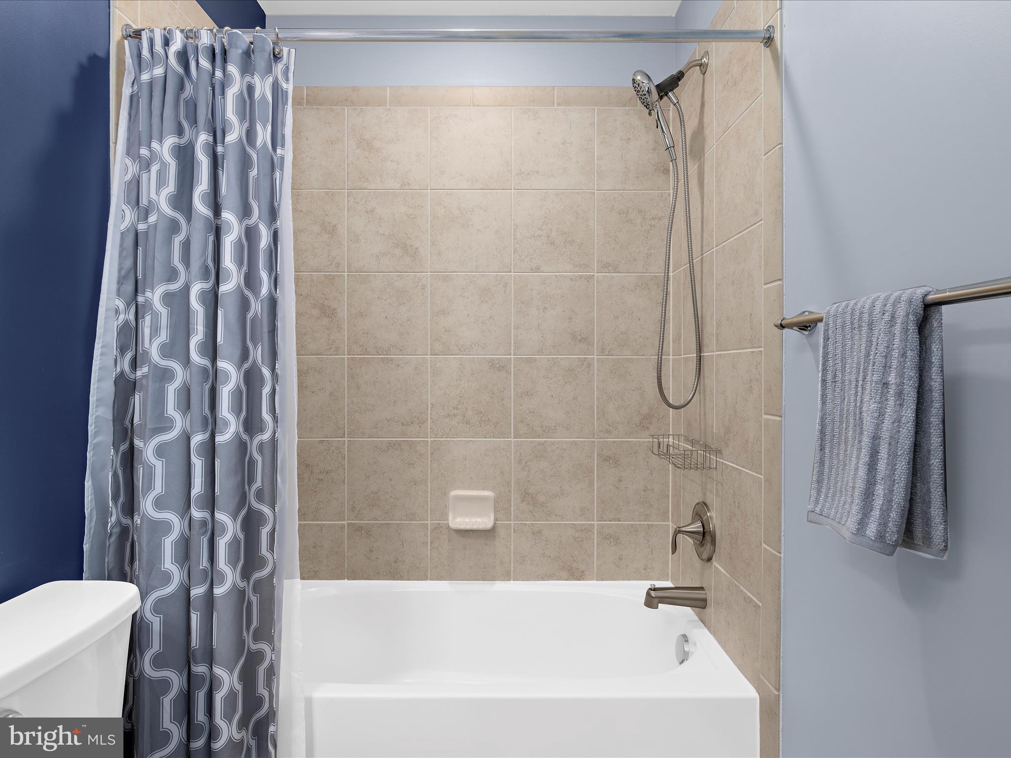 1008 Red Clover Road Gambrills, MD 21054 - Photo 41 of 51 a bathroom with a shower curtain and a sink