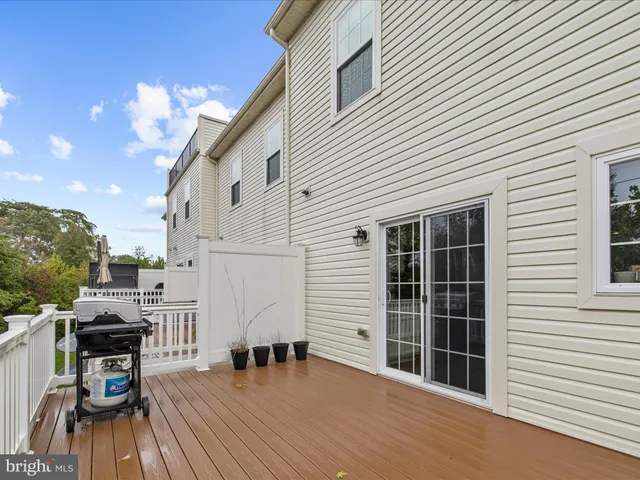 a view of a house with backyard porch and garden