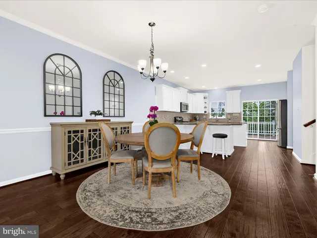 a view of a livingroom with furniture window and wooden floor