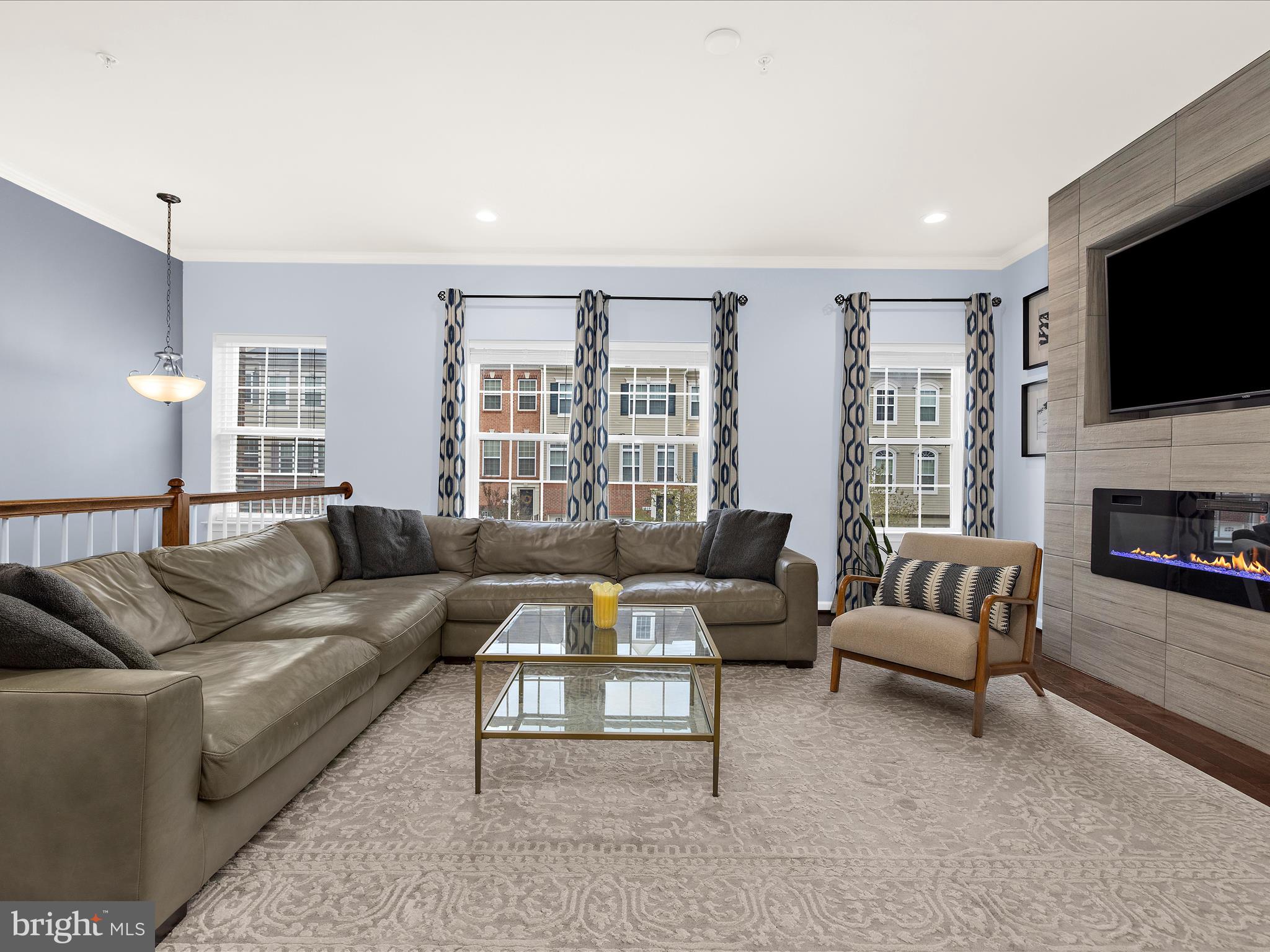 1008 Red Clover Road Gambrills, MD 21054 - Photo 6 of 51 a living room with furniture fireplace and flat screen tv