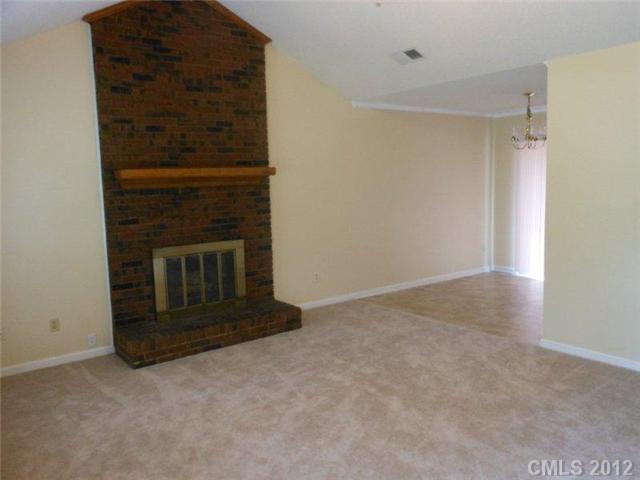 14521 Cinnamon Field Road Charlotte, NC 28273 - Photo 2 of 14 a view of an empty room with a fireplace