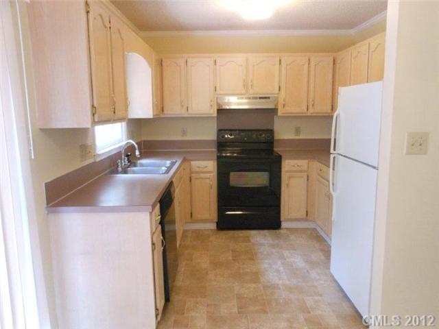 14521 Cinnamon Field Road Charlotte, NC 28273 - Photo 11 of 14 a kitchen with a refrigerator sink and cabinets