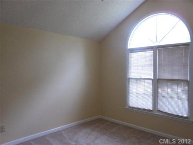 14521 Cinnamon Field Road Charlotte, NC 28273 - Photo 8 of 14 an empty room with a window
