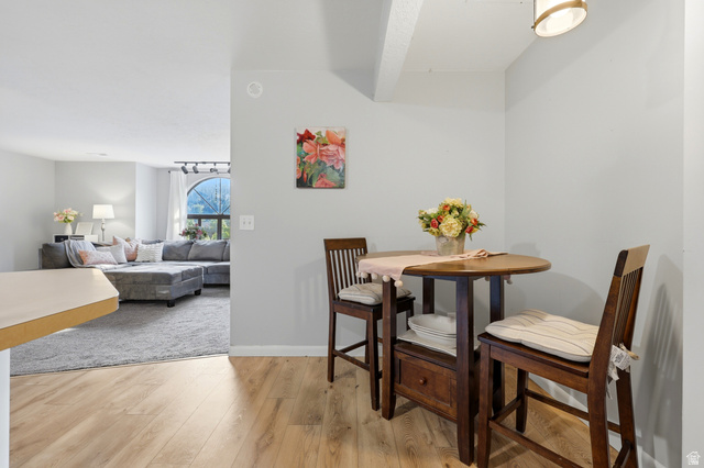 1175 Canyon Road, Unit 86 Ogden, UT 84404 - Photo 15 of 29 Dining nook featuring wood-finish flooring, a contemporary ceiling light fixture, and light gray wall paint