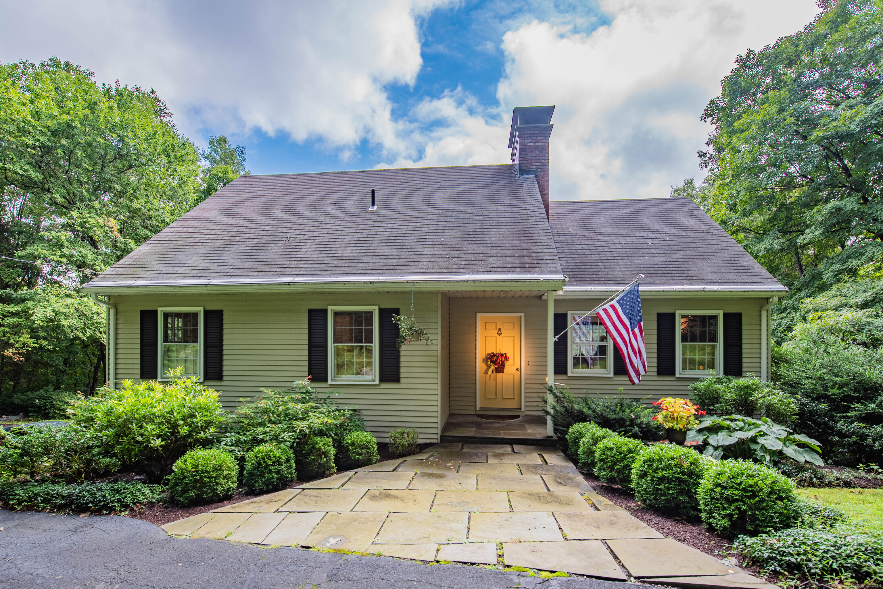 a front view of a house with garden