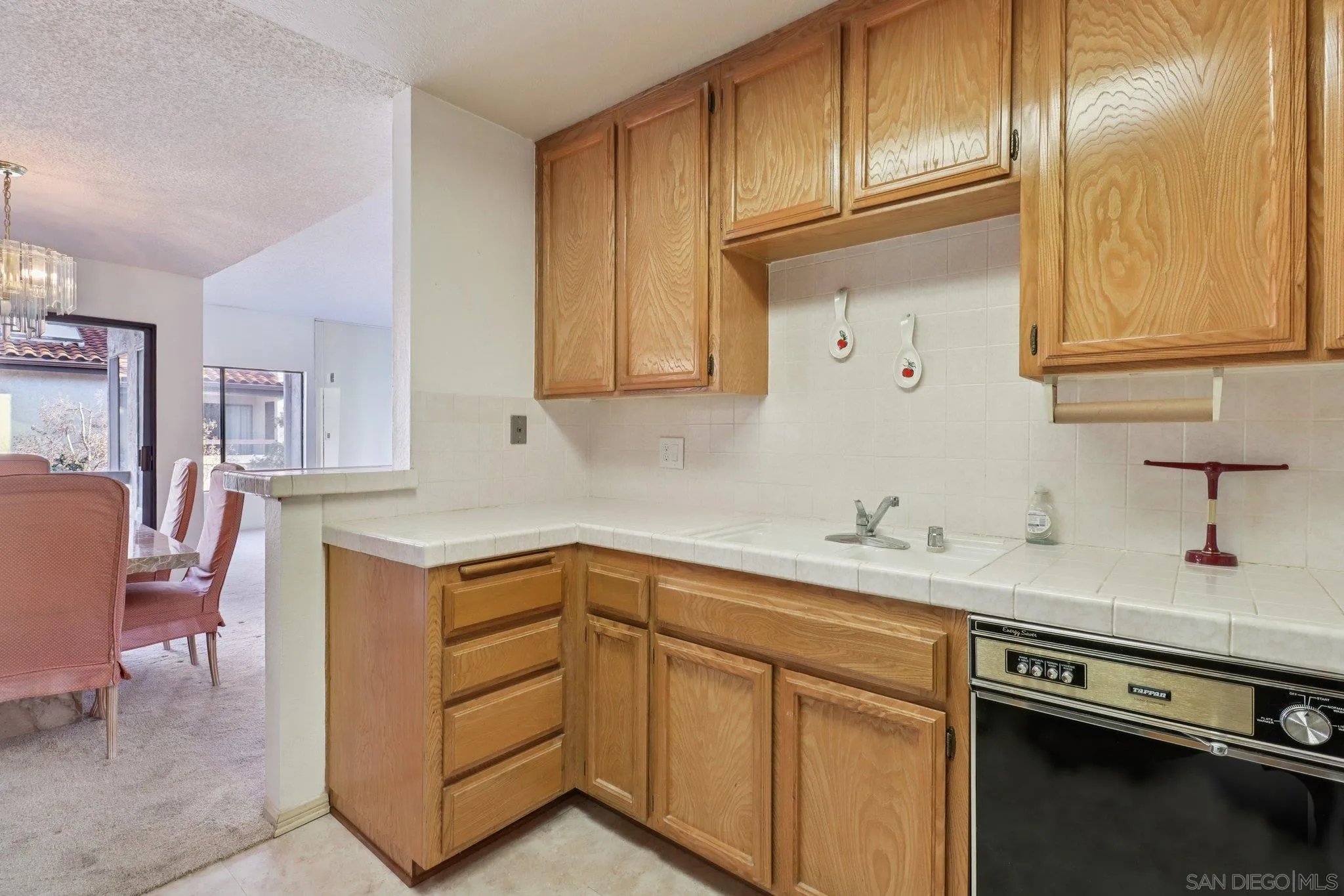 5645 Friars Road, Unit 386 San Diego, CA 92110 - Photo 13 of 45 a kitchen with stainless steel appliances granite countertop a sink stove and cabinets