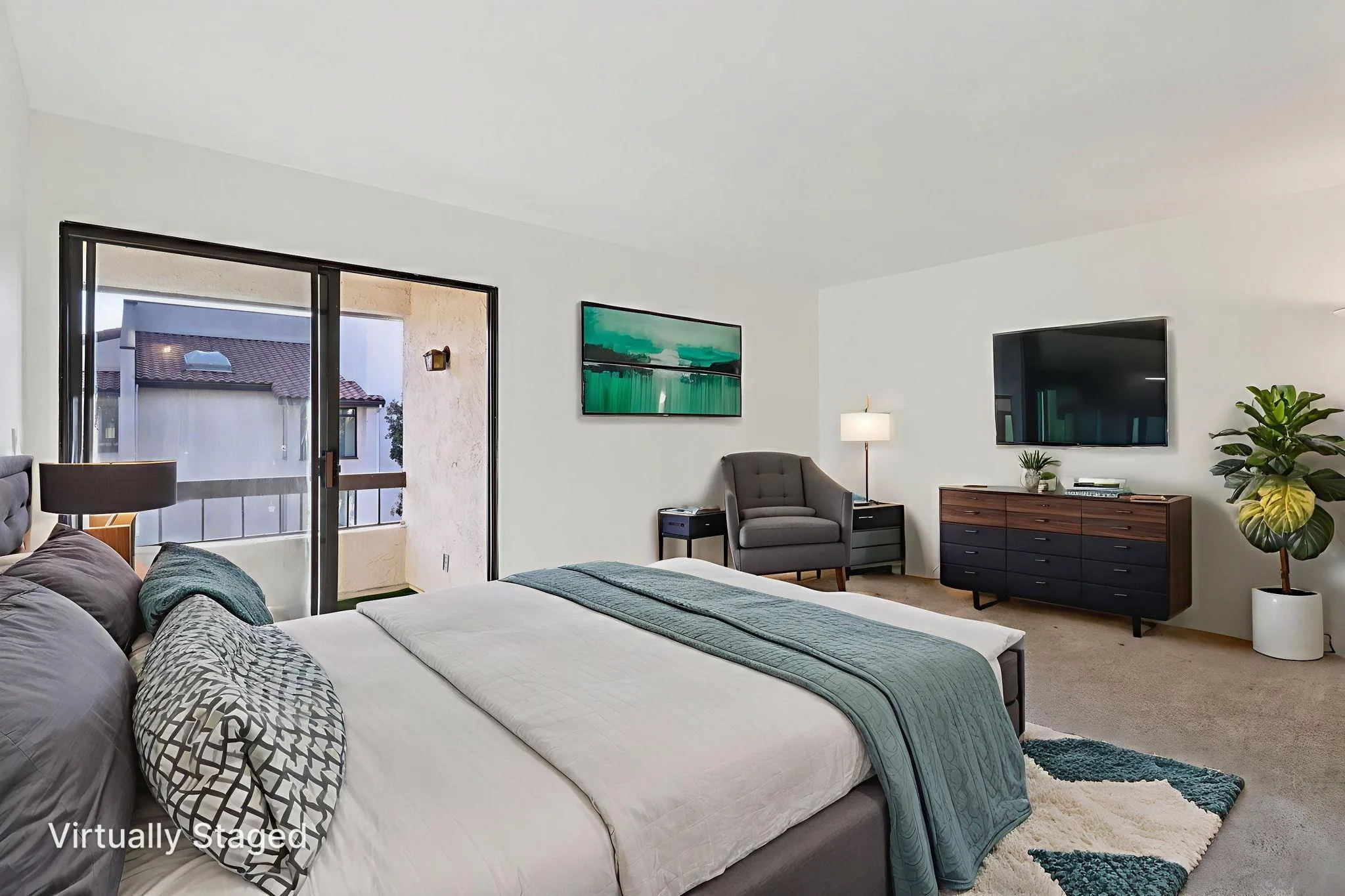 5645 Friars Road, Unit 386 San Diego, CA 92110 - Photo 14 of 45 a bedroom with a bed and a flat screen tv