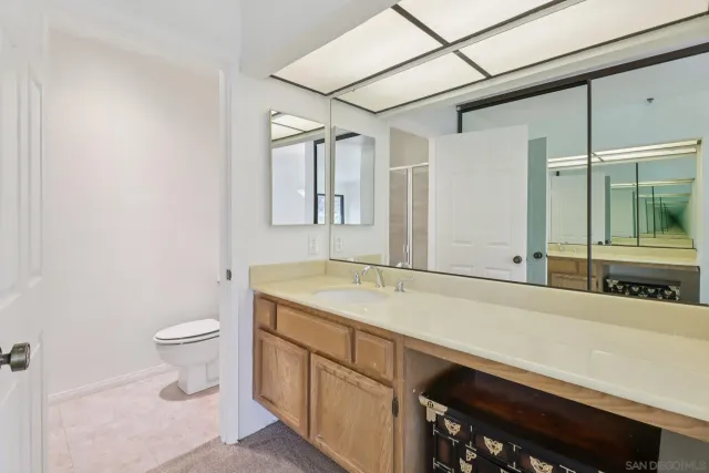 a bathroom with a glass shower door