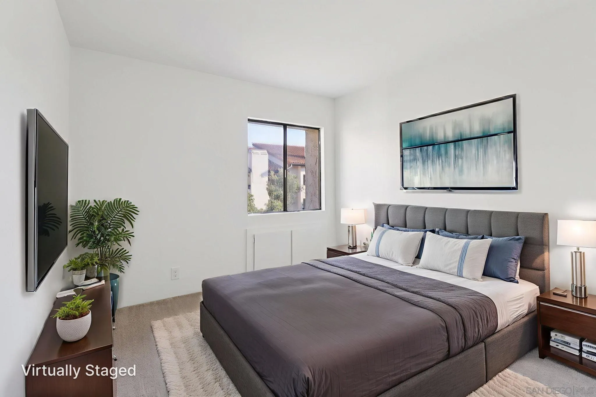 5645 Friars Road, Unit 386 San Diego, CA 92110 - Photo 21 of 45 a bedroom with a bed and a painting on the wall