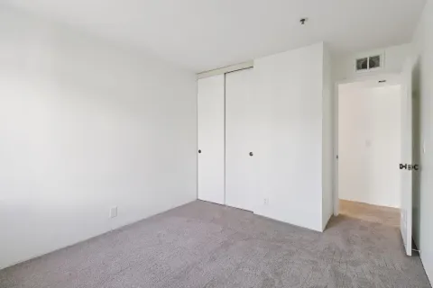 a bathroom with a sink a mirror toilet and shower
