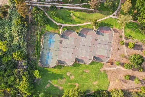 an aerial view of residential houses with outdoor space