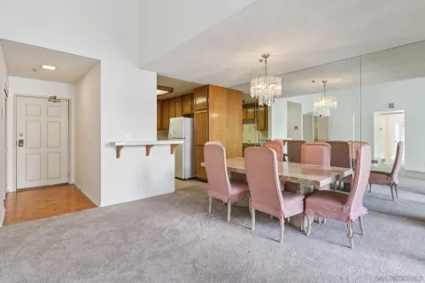 a view of a dining room with furniture and window