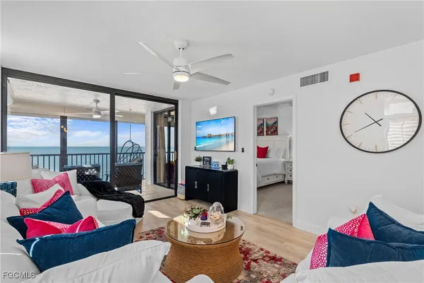 a living room with furniture and a rug