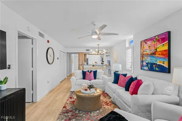 a kitchen with refrigerator and cabinets