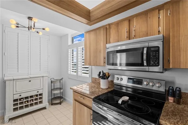 a kitchen with a stove and a microwave