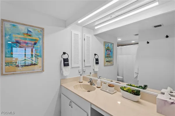 a bathroom with a shower and a toilet