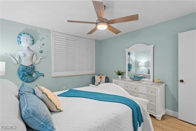 a bathroom with a sink a toilet and shower curtain
