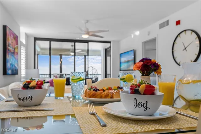 a balcony with furniture and a potted plant