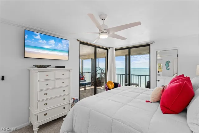 a bedroom with a bed and a flat tv screen