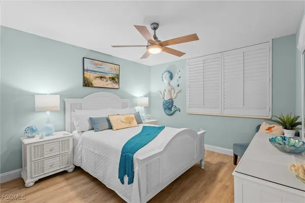 a bedroom with a bed and a table in it