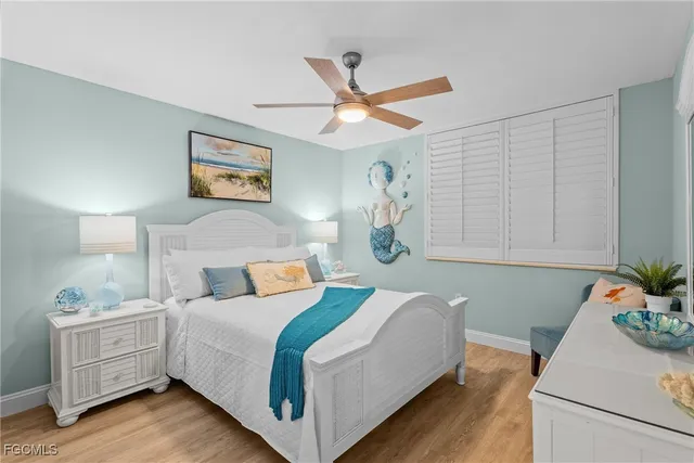 a bedroom with a bed and a table in it