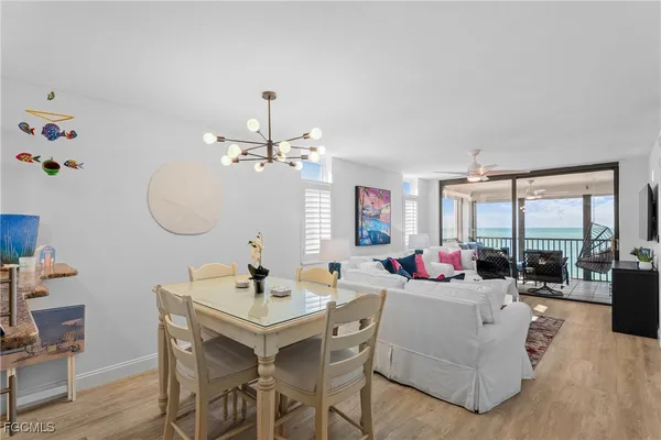 a view of a dining room with furniture and wooden floor