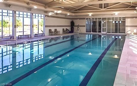 498 Pebble Run Avenue Henderson, NV 89011 - Photo 36 of 47 Dive into relaxation with this welcoming indoor swimming pool, ideal for year-round enjoyment.