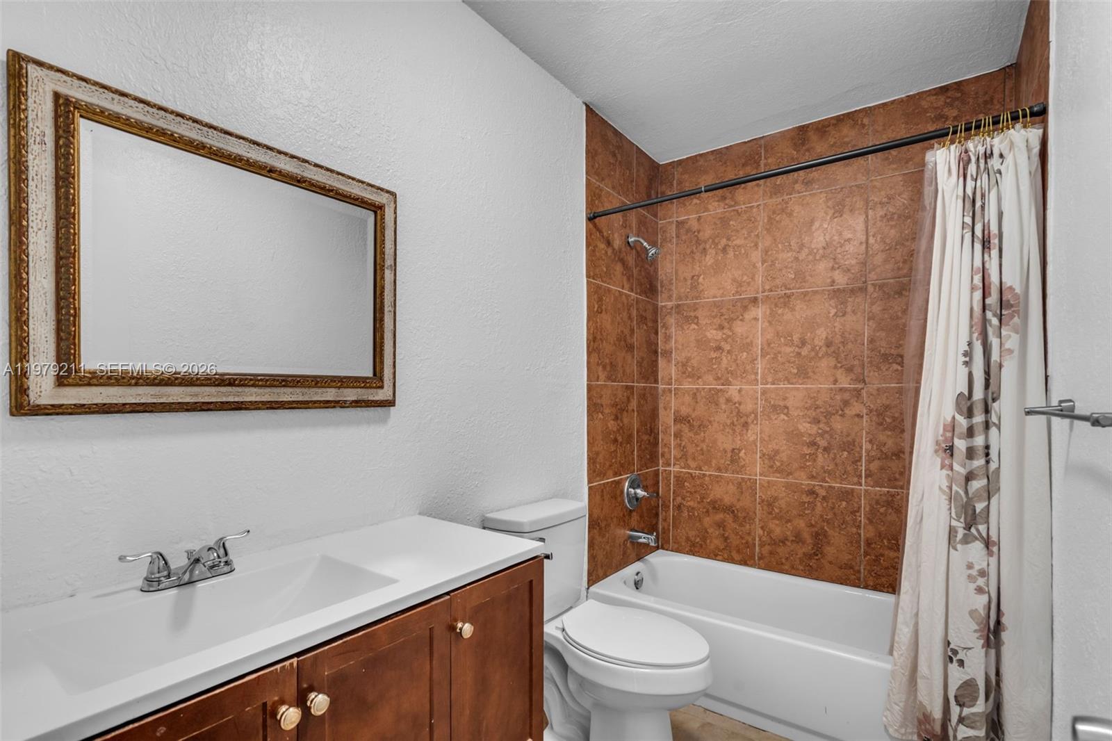 3785 Raleigh Street Hollywood, FL 33021 - Photo 21 of 36 a bathroom with a sink toilet and shower