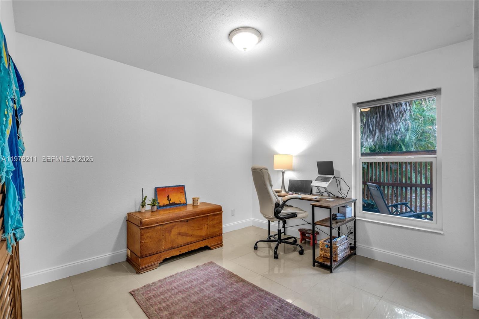 3785 Raleigh Street Hollywood, FL 33021 - Photo 22 of 36 a living room with furniture and a window
