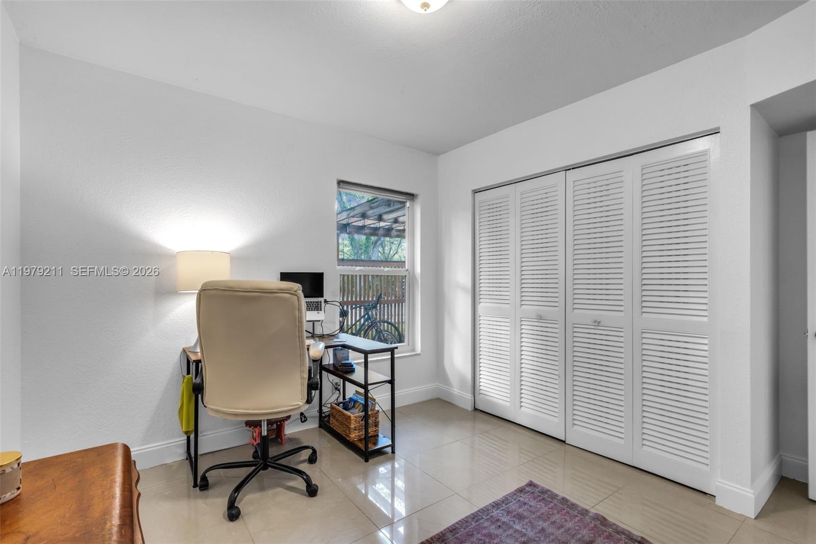 3785 Raleigh Street Hollywood, FL 33021 - Photo 23 of 36 a workspace with furniture and a window