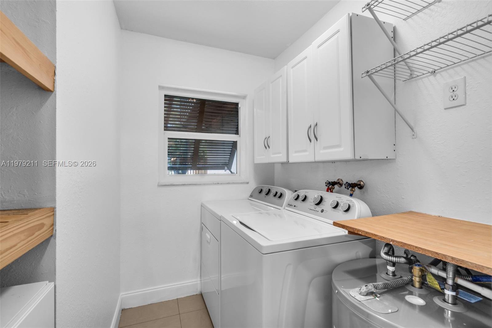 3785 Raleigh Street Hollywood, FL 33021 - Photo 24 of 36 a utility room with dryer and washer