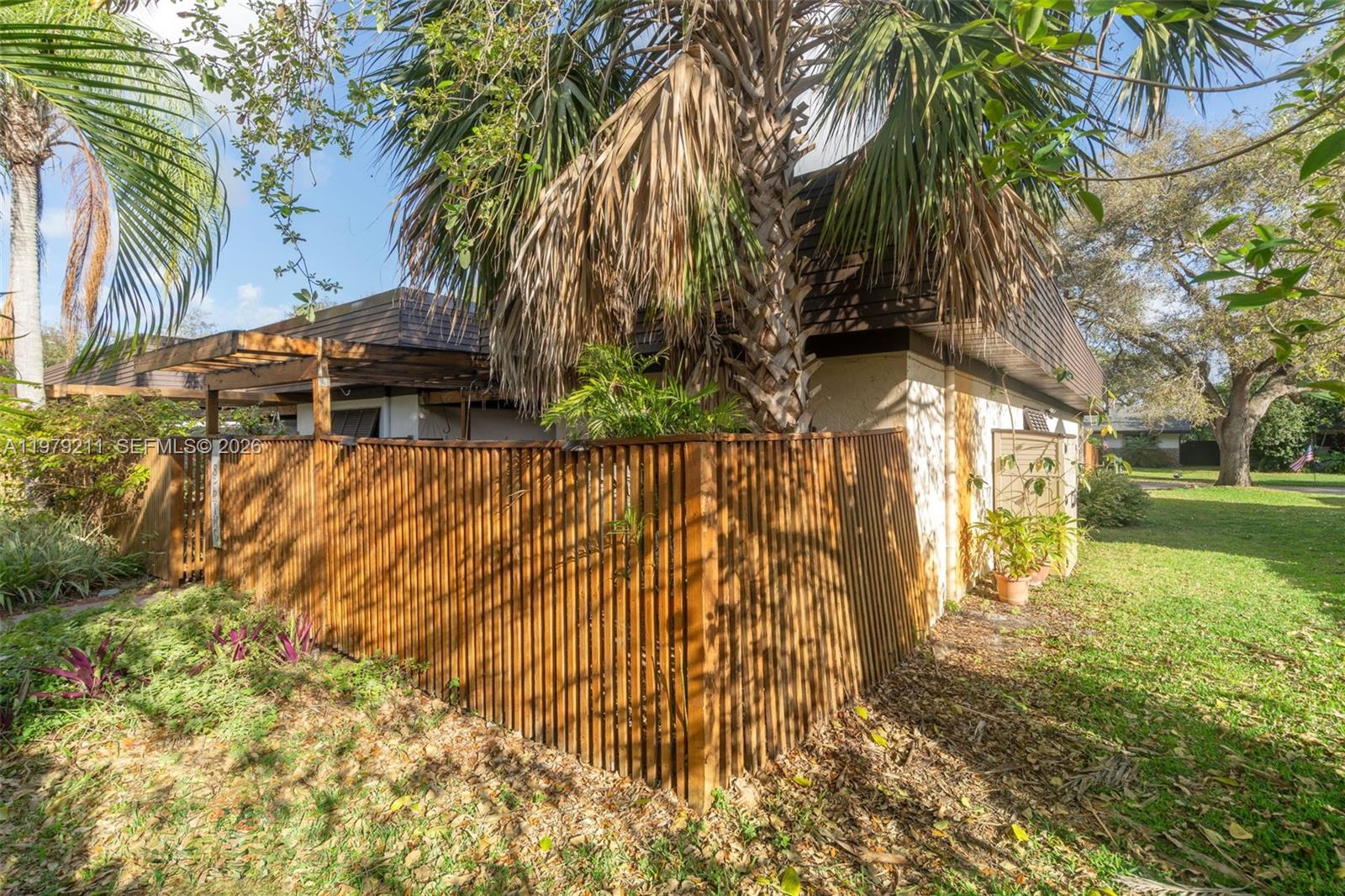 3785 Raleigh Street Hollywood, FL 33021 - Photo 27 of 36 a view of a yard with plants and trees