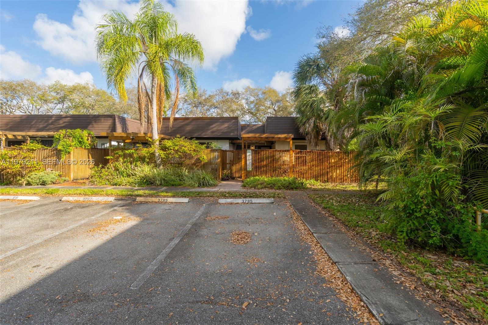 3785 Raleigh Street Hollywood, FL 33021 - Photo 30 of 36 a view of a street with palm trees