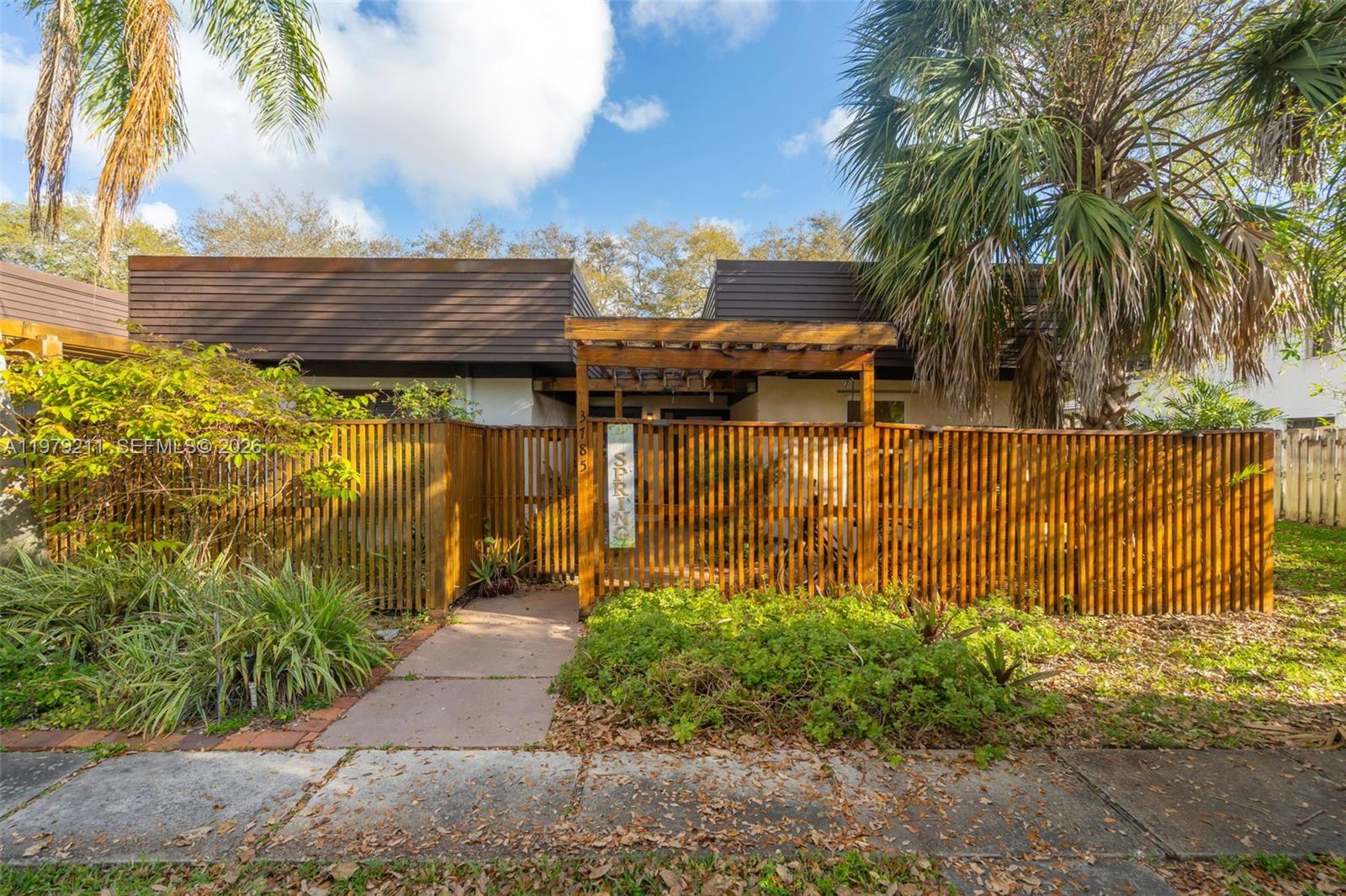 3785 Raleigh Street Hollywood, FL 33021 - Photo 3 of 36 a view of a garden