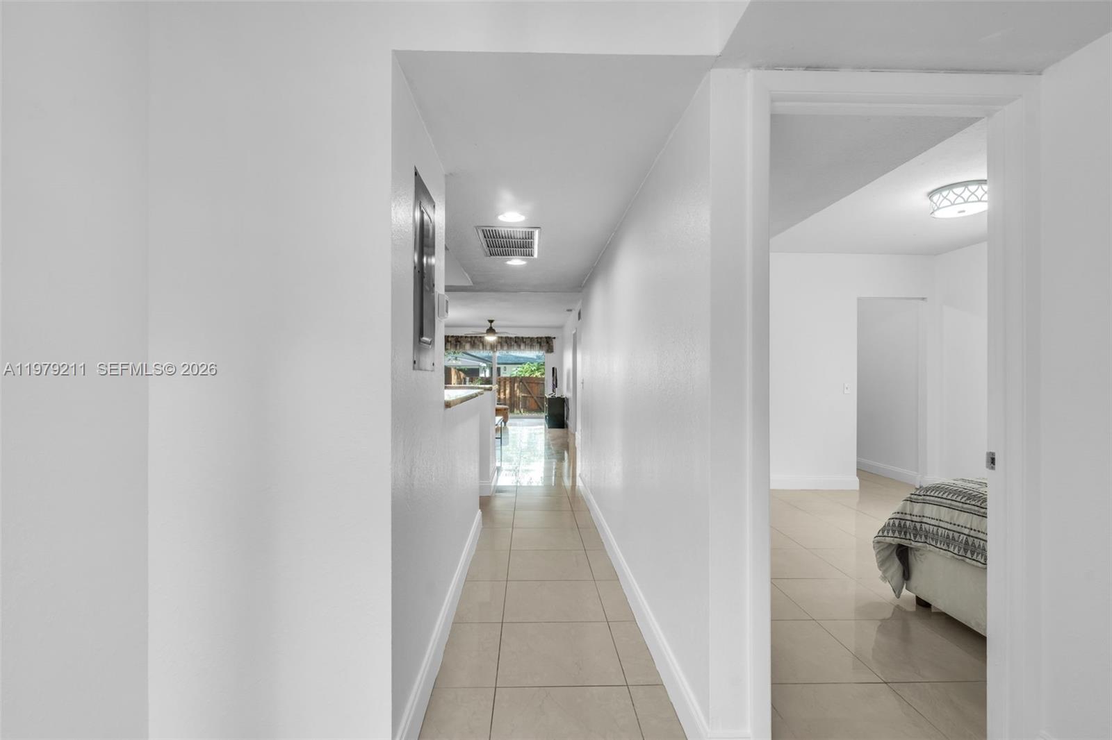 3785 Raleigh Street Hollywood, FL 33021 - Photo 4 of 36 a view of a hallway with wooden floor