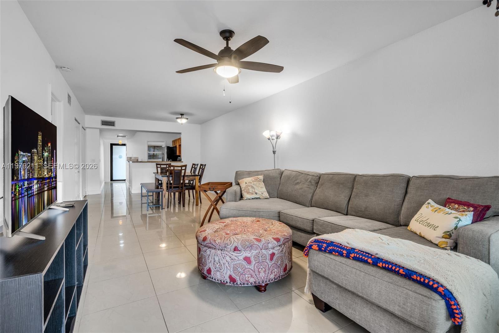 3785 Raleigh Street Hollywood, FL 33021 - Photo 5 of 36 a living room with furniture and kitchen view