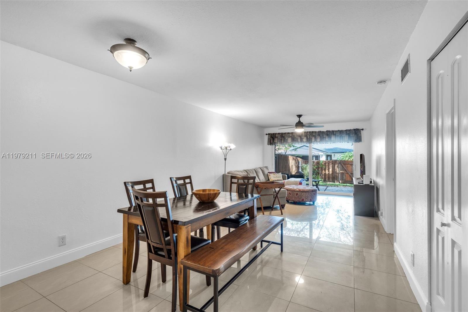 3785 Raleigh Street Hollywood, FL 33021 - Photo 9 of 36 a living room with furniture and a chandelier