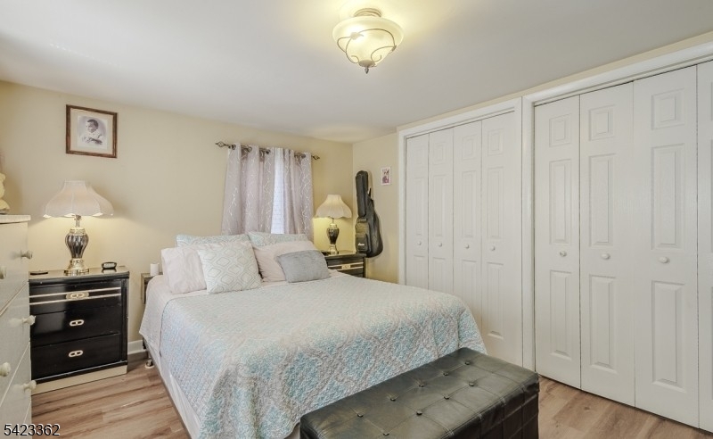 66 Garrison Street Newark, NJ 07105 - Photo 19 of 25 a bedroom with a bed and a closet