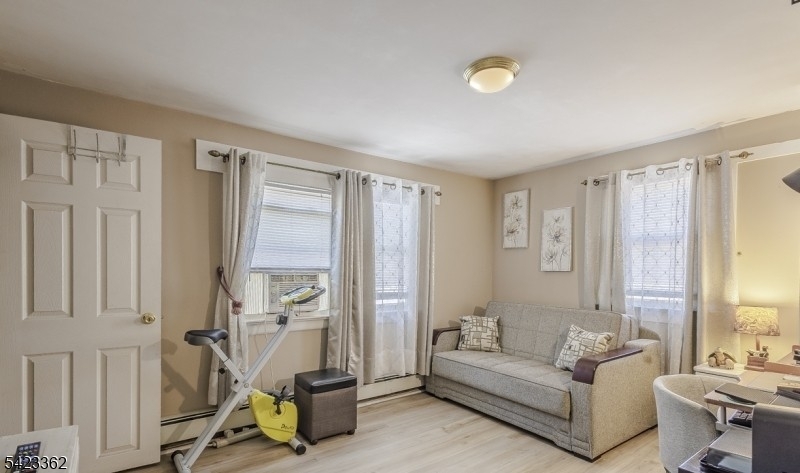 66 Garrison Street Newark, NJ 07105 - Photo 20 of 25 a living room with furniture and a window