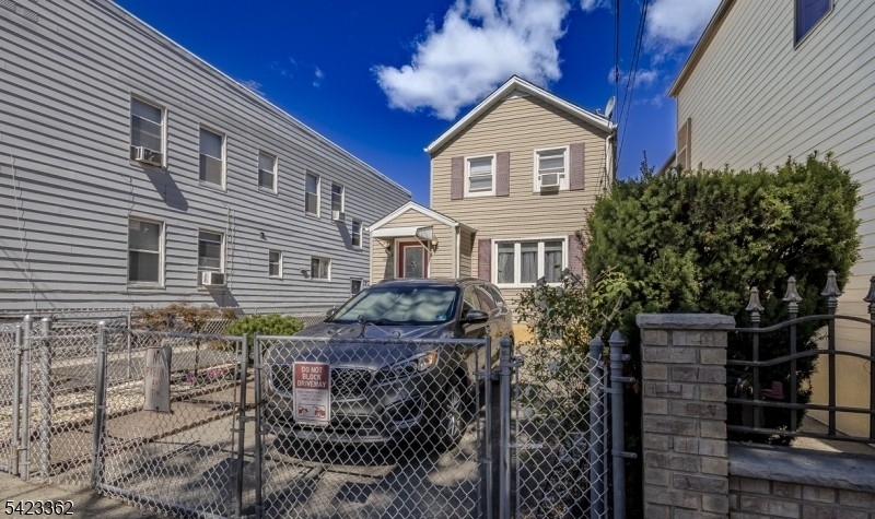 66 Garrison Street Newark, NJ 07105 - Photo 2 of 25 a front view of a house with balcony