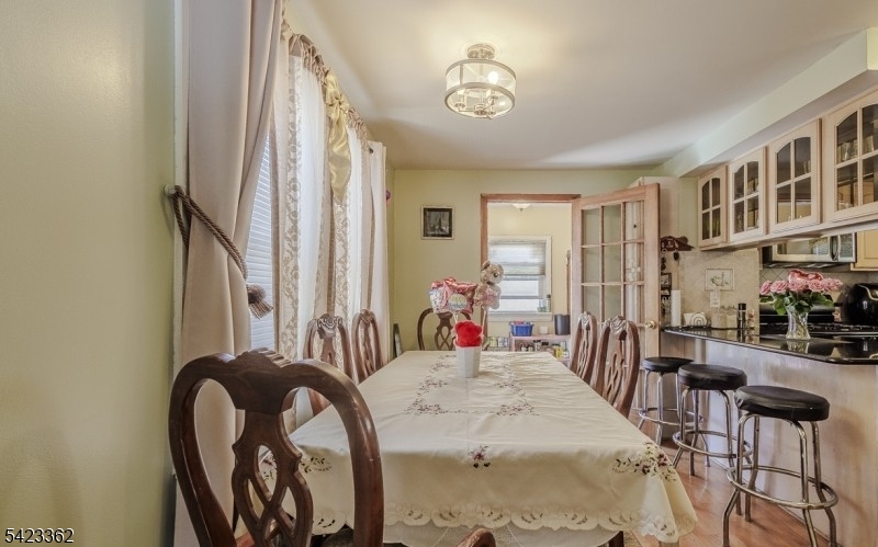 66 Garrison Street Newark, NJ 07105 - Photo 10 of 25 a bed room with a bed and a chair