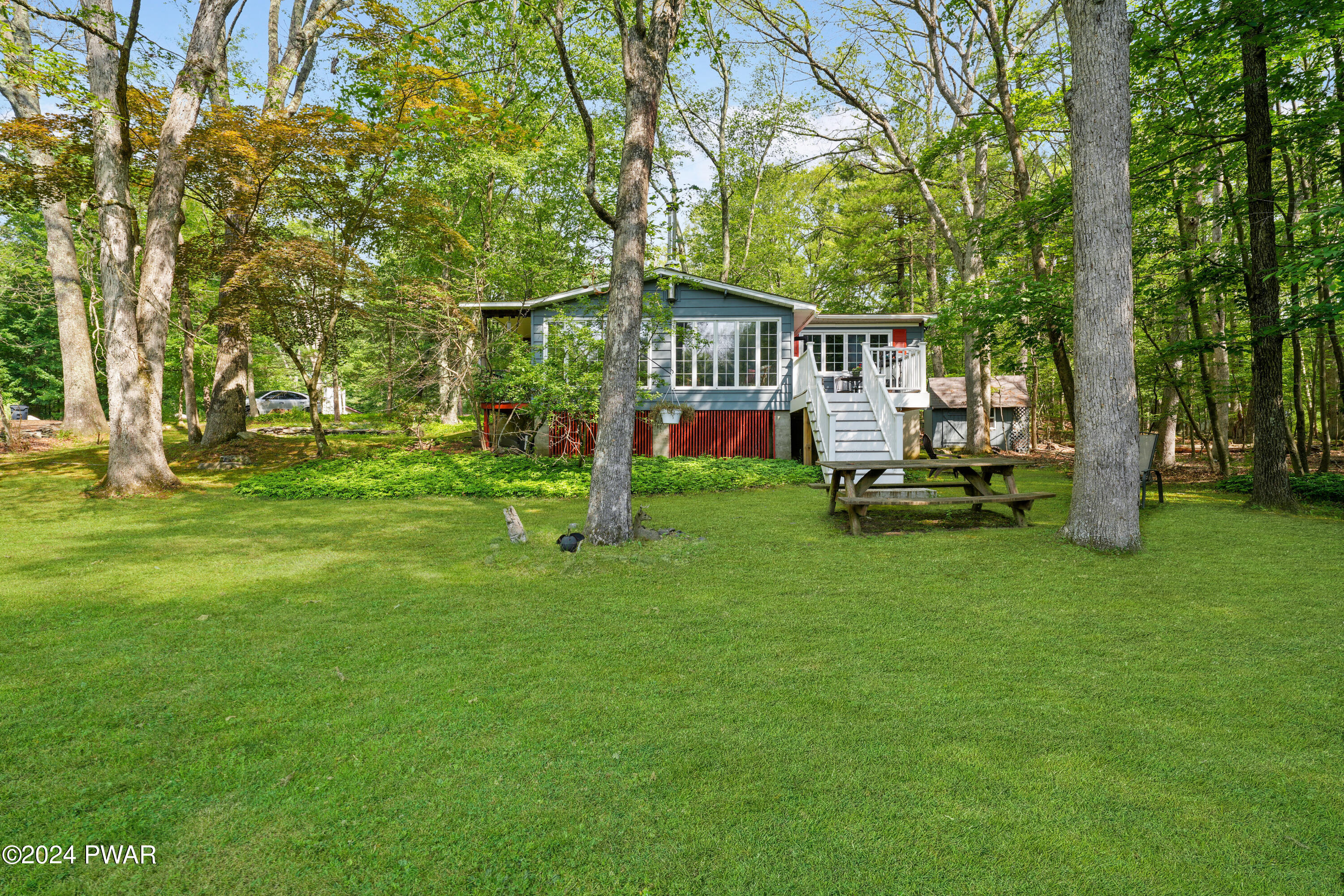 130 Beech Road Dingmans Ferry, PA 18328 - Photo 2 of 31 a view of a house with a big yard