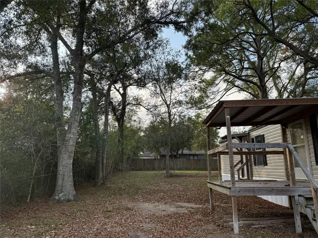 a view of house with a trees in the background