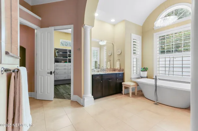 a view of a grassy field with trees in the background