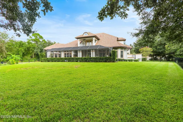 an aerial view of a house with outdoor space and street view