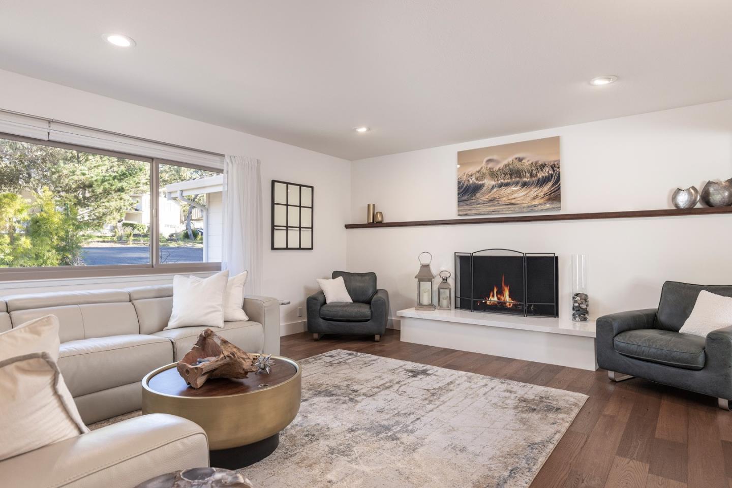 3128 Stevenson Drive Pebble Beach, CA 93953 - Photo 11 of 35 a living room with furniture and a fireplace