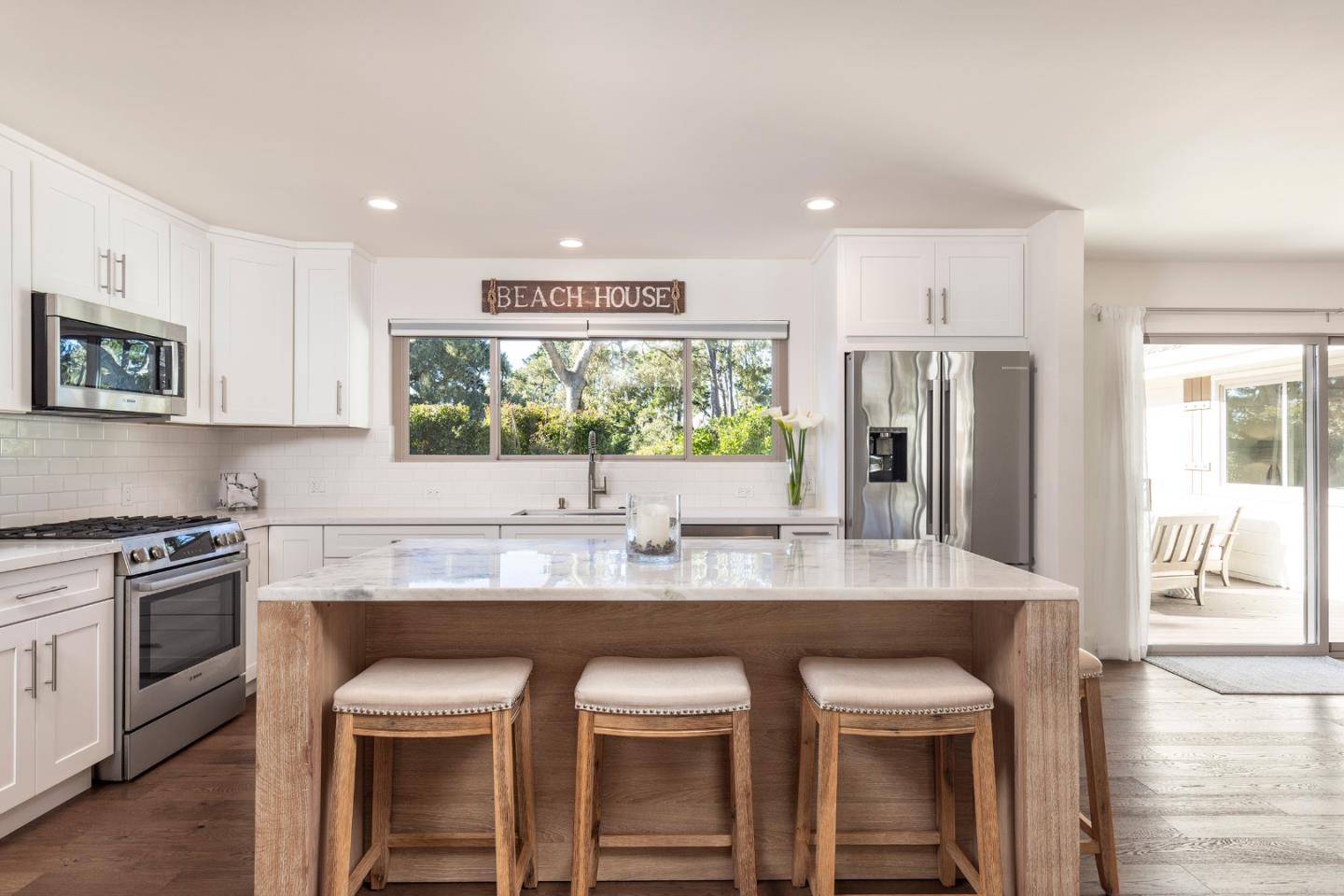3128 Stevenson Drive Pebble Beach, CA 93953 - Photo 13 of 35 a kitchen with kitchen island a counter top space a sink stainless steel appliances and cabinets