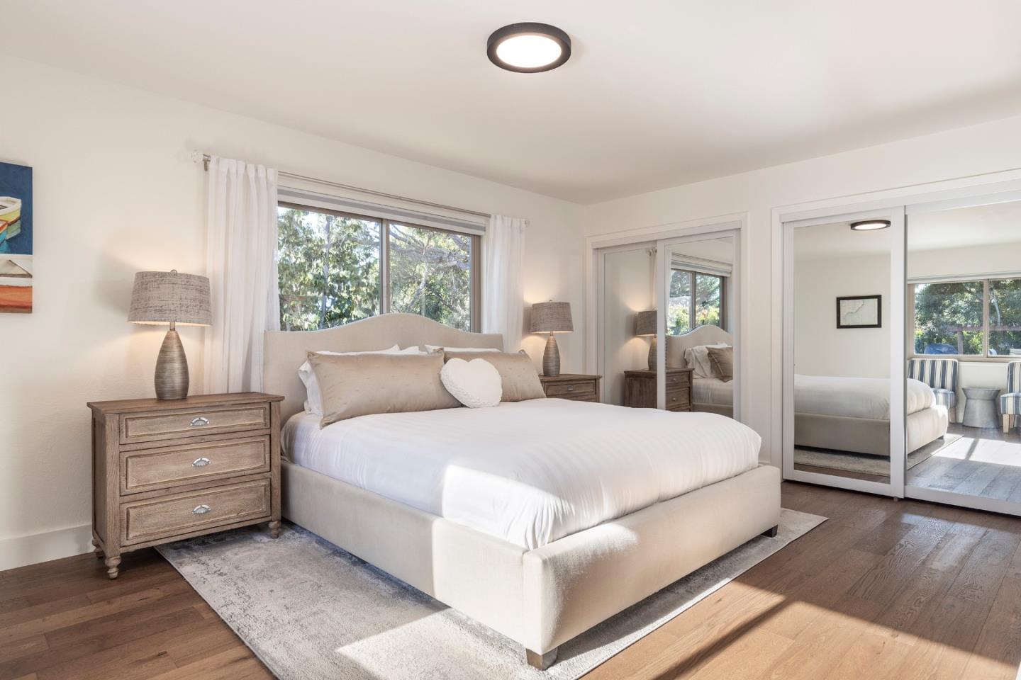 3128 Stevenson Drive Pebble Beach, CA 93953 - Photo 17 of 35 a large bedroom with a bed and large window