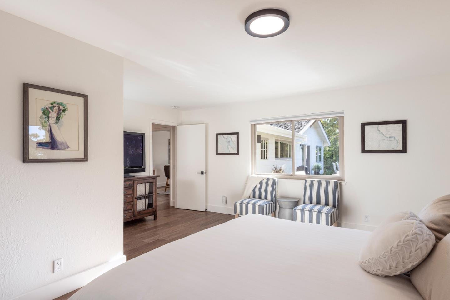 3128 Stevenson Drive Pebble Beach, CA 93953 - Photo 18 of 35 a bedroom with furniture and a window