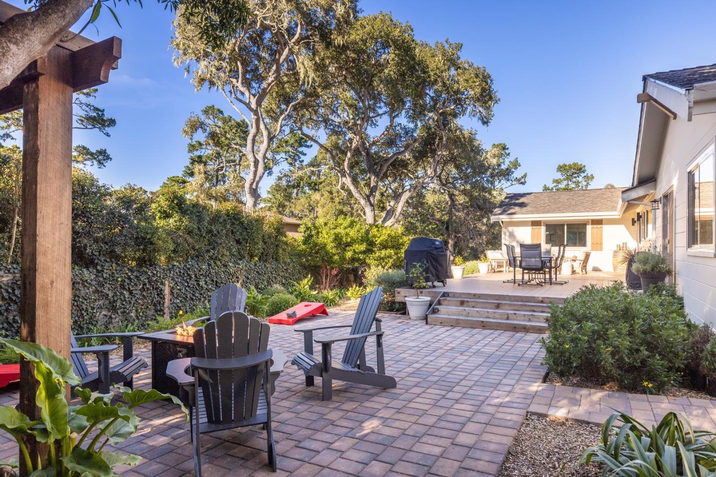 3128 Stevenson Drive Pebble Beach, CA 93953 - Photo 29 of 35 a view of a patio with table and chairs and potted plants